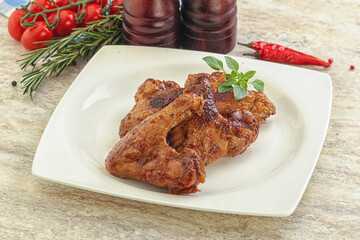 Roasted chicken wings with spicy sauce