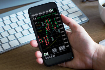 Businessman analyzing forex trading graph financial data. Business finance background.Stock Market Investments Funds