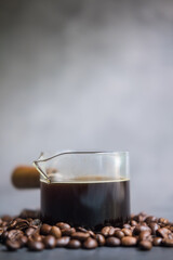 Espresso coffee shot and coffee beans. Close up