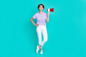Full length photo of charming sweet girl dressed purple t-shirt holding loudspeaker isolated teal...
