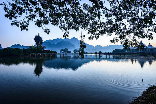 Mountains and the still waters of the Hpa An lake.