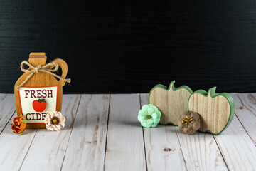 Fresh Cider and wooden apples background for fall projects, with wooden and black rustic background