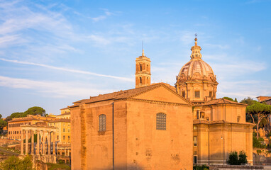 Fototapeta na wymiar Sunrise light with blue sky on Roman ancient architecture in Rome, Italy