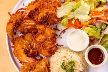 Fried shrimp breaded with coconut, sweet sauce, salad and rice, food, gastronomy