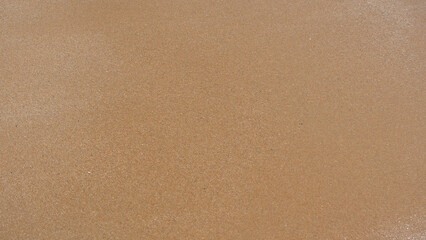 golden sand texture background of the beach