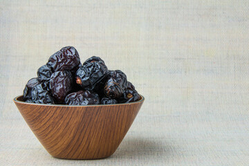 Delicious ajwa dates ( kurma nabi ), Much sought after during the month of Ramadan as a dish for breaking the fast, ramadhan kareem, empty space, copy space.