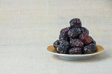 Delicious ajwa dates ( kurma nabi ), Much sought after during the month of Ramadan as a dish for breaking the fast, ramadhan kareem, empty space, copy space.