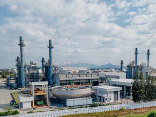 Obraz premium Top view Industrial zone,The equipment of oil refining,Close-up of industrial pipelines of an oil-refinery plant,Detail of oil pipeline with valves in large oil refinery.