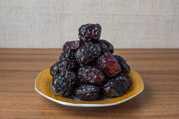 Delicious ajwa dates ( kurma nabi ), Much sought after during the month of Ramadan as a dish for breaking the fast, ramadhan kareem, empty space, copy space.