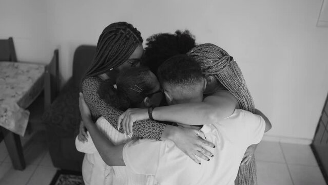 Friends and family group hug closeup in monochromatic