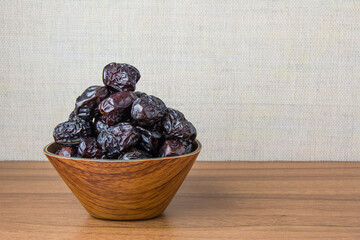 Delicious ajwa dates ( kurma nabi ), Much sought after during the month of Ramadan as a dish for breaking the fast, ramadhan kareem, empty space, copy space.