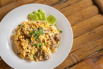 Thai pork fried rice in a white plate