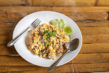 Thai pork fried rice in a white plate