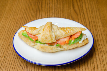 Croissant with red fish and avocado