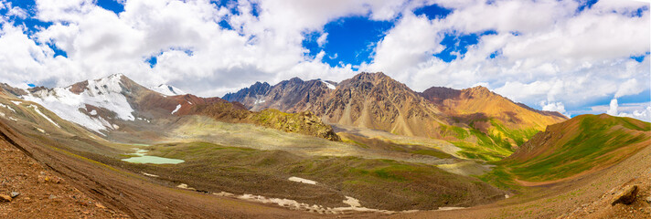 Mountain blue lake among the rocks. Beautiful landscape. Wonderful nature. Long banner, panoramic...