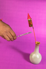 Stack of fire crackers with sweets for Diwali celebration