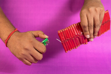 Stack of fire crackers with sweets for Diwali celebration