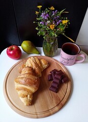 breakfast with tea and croissant