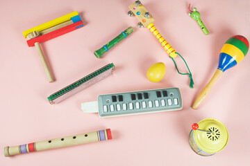 Children's musical instruments toys. Wooden whistles, rattle, percussion instrument, mouth...