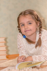 little girl reading a book