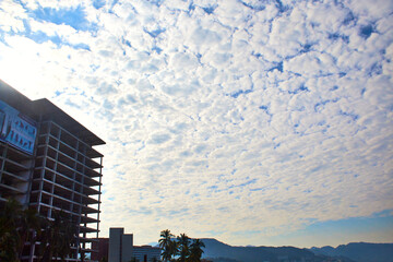 cloudscape with texture in the sky and building in the corner, puerto vallarta jalisco 