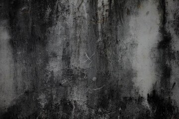 Obraz premium A weathered concrete wall with cracks and peeling paint, showing signs of age and decay.