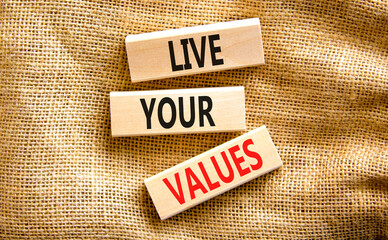 Live your values symbol. Concept words Live your values on wooden blocks. Beautiful canvas table canvas background. Business, psychological and live your values concept. Copy space.