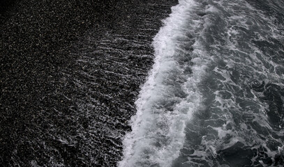 Waves of black sea during overcast cloudy weather, stormy water, storm in Batumi