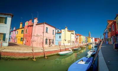 Fototapeta na wymiar Burano village with colorful house architecture with pure summer feeling 
