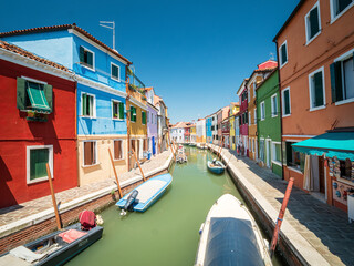 Fototapeta premium Burano village with colorful house architecture with pure summer feeling 
