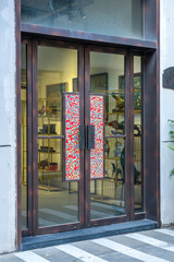 Fototapeta na wymiar Glass doors of urban street shops
