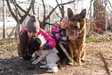 two little girls with a german shepherd