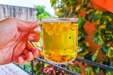 Glass or cup pot with hot ginger tea.