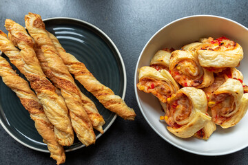 a roll of puff pastry with the addition of cheese, ham and pepper in the company sticks of puff...