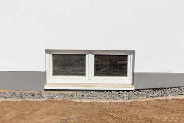 cellar window at a new built family house with window sill