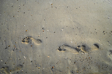 footprint on beach sand, top view