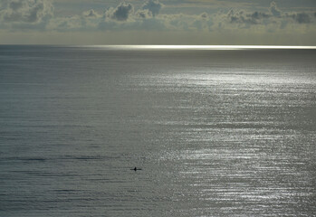 Solitary paddler out at dawn off the Florida coast