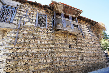 Naklejka premium Düğmeli Evler ( Buttoned houses ) with old the traditional architectural style of the Anatolian towns of İbradı and Ormana. Antalya – Turkey