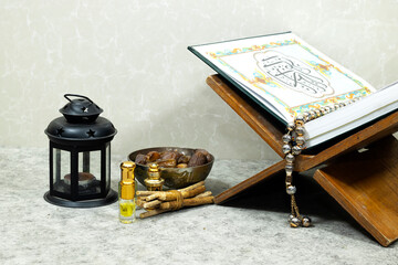 Mawlid al nabi or ramadan, eid concept. lantern with perfume holy book on stand and dates fruit