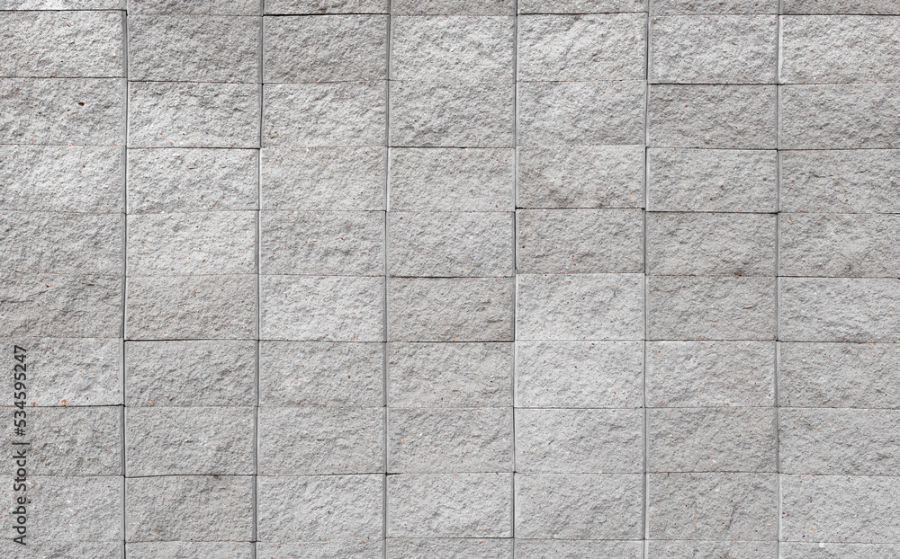 Poster grey brick wall background close up. gray stone tile block background with horizontal textured relie