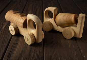 Wooden toy car on a dark background