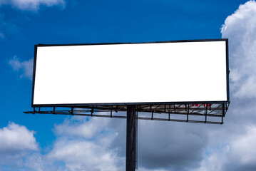 A blank billboard against a blue sky