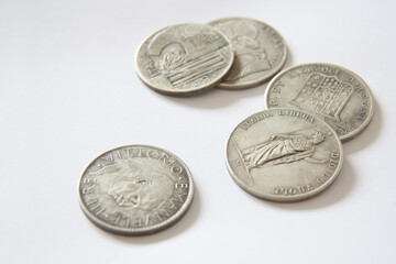 Old Italian coins of 1800. Close-up coin, 20 lire, dating back to 1928, the Italian Kingdom and  profile of the King, on white background. 