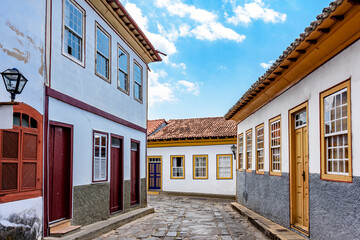 Street with cobblestones and houses with colonial architecture in the old and historic city of...