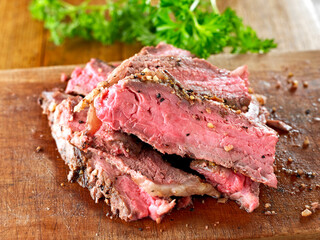 Slice of grilled  Steak on chopping board