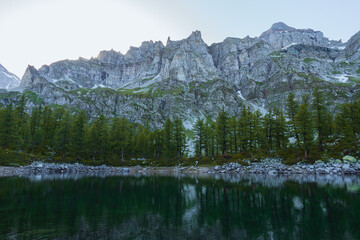 the "lago nero", a small alpine lake in the mountains of the alpe veglia - alpe devero nature park, near the town of Baceno, Italy - June 2022.