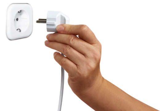 Energy series: man puts power plug into socket.