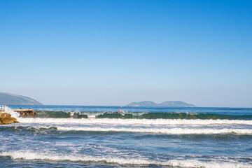 Bright blue ocean in a clear blue sky, with islands on the horizon, Vlore, Albania