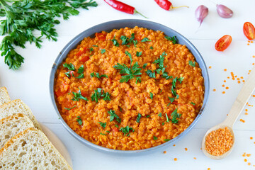 Red lentil dish with tomatoes and peppers. Vegetarian cooking