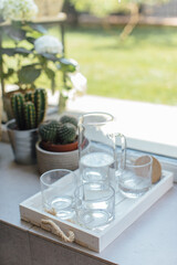 Glasses of water on the windowsill, still life.